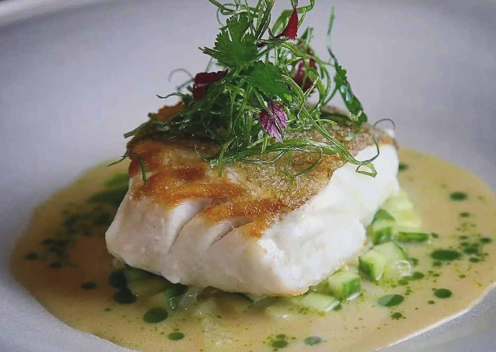 Crispy-skin halibut with cucumber and herb butter sauce