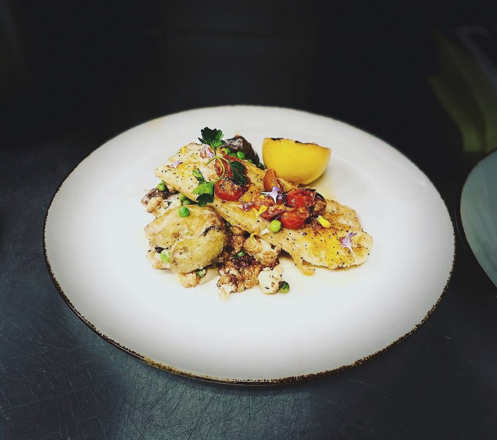 Pan-roasted fish with blistered tomatoes and cauliflower