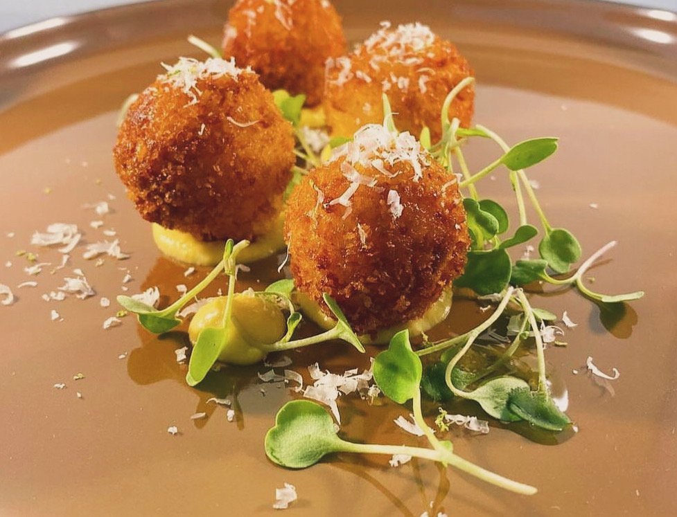 Golden croquettes with pea puree and micro greens